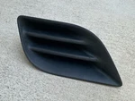 2012-2015 Nissan Versa Driver Fog Light Cover 62257-3BA0A. Fixed Price $15.22.