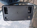 Oem 2001-2004 Dodge Grand Caravan Front License Plate Bracket Holder 4857329AB. Fixed Price $21.99.