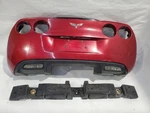 2005 Chevrolet Corvette Oem Magnetic Red Complete Rear Bumper Assembly. Fixed Price $500.00.